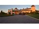 Charming golf cart parking area, and beautifully landscaped clubhouse with elegant architectural details at 4188 Muirfield Loop, Lake Wales, FL 33859