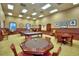 Spacious game room featuring a pool table, poker table, and lounge seating at 4188 Muirfield Loop, Lake Wales, FL 33859