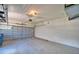 Attached garage with metal door and a concrete floor at 4188 Muirfield Loop, Lake Wales, FL 33859