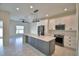 Bright kitchen boasts an island, stainless appliances, and an open concept layout at 4188 Muirfield Loop, Lake Wales, FL 33859