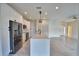 Bright kitchen features an island, stainless appliances, and an open floor plan at 4188 Muirfield Loop, Lake Wales, FL 33859
