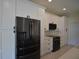 Modern kitchen featuring white cabinets, quartz countertops, and stainless steel appliances at 4188 Muirfield Loop, Lake Wales, FL 33859