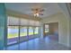 Enclosed lanai with view of a lake at 4188 Muirfield Loop, Lake Wales, FL 33859