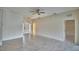 Open-concept living room featuring marble floors, neutral paint, and an adjacent room at 4188 Muirfield Loop, Lake Wales, FL 33859