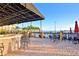 Outdoor patio space with brick flooring, stylish seating, and water views at 4188 Muirfield Loop, Lake Wales, FL 33859