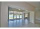 Bright living area with serene water view, large windows, and tile flooring at 4188 Muirfield Loop, Lake Wales, FL 33859