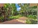 An expansive backyard with mature trees and lush landscaping, creating a private outdoor oasis at 4219 Forest Hills Dr, Lakeland, FL 33813
