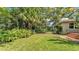 Lush backyard with mature trees and beautiful landscaping for ultimate privacy at 4219 Forest Hills Dr, Lakeland, FL 33813