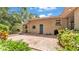 Backyard patio with a dark blue back door surrounded by lush green plants at 4219 Forest Hills Dr, Lakeland, FL 33813