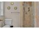 Bathroom features toilet and glass-enclosed tiled shower stall at 4219 Forest Hills Dr, Lakeland, FL 33813