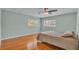 Bedroom with hardwood floors, windows, and neutral tones at 4219 Forest Hills Dr, Lakeland, FL 33813