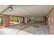 Spacious carport with brick columns, providing sheltered parking and access to the home's entrance at 4219 Forest Hills Dr, Lakeland, FL 33813