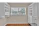 Walk-in closet with white shelving and storage overlooking window at 4219 Forest Hills Dr, Lakeland, FL 33813