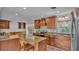 Bright kitchen with granite countertops, island, custom hood and stainless appliances at 4219 Forest Hills Dr, Lakeland, FL 33813