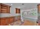 Elegant kitchen with dark wood cabinetry, granite countertops, and built-in shelving, great for storage at 4219 Forest Hills Dr, Lakeland, FL 33813