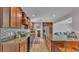Modern kitchen with granite countertops, dark wood cabinetry, and updated appliances, perfect for cooking at 4219 Forest Hills Dr, Lakeland, FL 33813