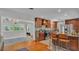 Well-equipped kitchen with stainless steel appliances, dark wood cabinets, and an adjacent dining area at 4219 Forest Hills Dr, Lakeland, FL 33813