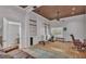 Cozy living room featuring built-in shelves, a ceiling fan, and access to additional rooms at 4219 Forest Hills Dr, Lakeland, FL 33813