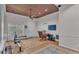 Bright and airy living room features ceiling fan and access to outdoor light and entry door at 4219 Forest Hills Dr, Lakeland, FL 33813