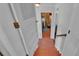Hallway with tiled flooring, light gray walls, and natural lighting at 4219 Forest Hills Dr, Lakeland, FL 33813