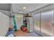 Well-organized storage room with shelving and a sliding door for easy access and natural light at 4219 Forest Hills Dr, Lakeland, FL 33813