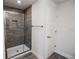 Bathroom featuring a glass enclosed shower with gray wood-look tiles at 5409 Waterside Dr, Auburndale, FL 33823