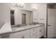 Bathroom featuring a double vanity with white cabinets and granite countertop at 5409 Waterside Dr, Auburndale, FL 33823