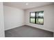 Bedroom with a large window allowing ample natural light at 5409 Waterside Dr, Auburndale, FL 33823