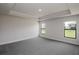 Large bedroom featuring recessed lights, gray carpet, and two large windows at 5409 Waterside Dr, Auburndale, FL 33823