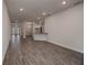 Spacious living room with wood-look tile floors and lots of natural light at 5409 Waterside Dr, Auburndale, FL 33823