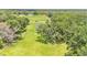 Aerial view of home located on treed lot at 59 Jimmy Lee Rd, Winter Haven, FL 33880