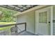 Charming balcony featuring a stylish metal railing and a cozy seating area for relaxation at 59 Jimmy Lee Rd, Winter Haven, FL 33880