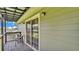 Relaxing balcony with a sliding glass door, perfect for enjoying the outdoors at 59 Jimmy Lee Rd, Winter Haven, FL 33880