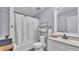 Functional bathroom with a shower-tub combo, white vanity, and towel rack at 59 Jimmy Lee Rd, Winter Haven, FL 33880