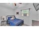 Comfortable bedroom with a cozy bed, window A/C, and a calming atmosphere at 59 Jimmy Lee Rd, Winter Haven, FL 33880
