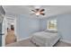 Bedroom with a window, a light blue wall, a closet and carpet flooring at 59 Jimmy Lee Rd, Winter Haven, FL 33880