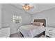 Serene bedroom featuring a soft bed, neutral colors, and natural light at 59 Jimmy Lee Rd, Winter Haven, FL 33880