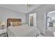 Comfortable bedroom with a view to kitchen and built-in shelving for storage at 59 Jimmy Lee Rd, Winter Haven, FL 33880