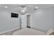Bedroom features a TV and fan, offering comfort and convenience for relaxation and entertainment at 59 Jimmy Lee Rd, Winter Haven, FL 33880