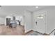 Entryway view looking into renovated kitchen with island and stainless appliances at 59 Jimmy Lee Rd, Winter Haven, FL 33880
