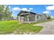 Charming exterior view highlighting the home's inviting covered porch with black support beams at 59 Jimmy Lee Rd, Winter Haven, FL 33880