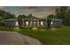 Charming single-story home featuring a welcoming front porch with swing and well-manicured landscaping at 59 Jimmy Lee Rd, Winter Haven, FL 33880