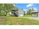 The detached garage of the home features a staircase and a second story deck at 59 Jimmy Lee Rd, Winter Haven, FL 33880