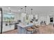 The kitchen features a gray island with bar seating and farm-style stainless steel sink at 59 Jimmy Lee Rd, Winter Haven, FL 33880