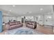Spacious living room featuring wood floors, neutral tones, and an open layout at 59 Jimmy Lee Rd, Winter Haven, FL 33880