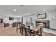 Open floor plan featuring a fireplace, dining room, and living area with a brown sofa at 59 Jimmy Lee Rd, Winter Haven, FL 33880