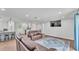 Open concept living space featuring hard wood floors, seating and bar area at 59 Jimmy Lee Rd, Winter Haven, FL 33880