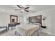 The main bedroom boasts modern decor with a ceiling fan and convenient furniture at 59 Jimmy Lee Rd, Winter Haven, FL 33880