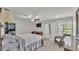 Spacious main bedroom includes a TV, ceiling fan, and private sitting area at 59 Jimmy Lee Rd, Winter Haven, FL 33880