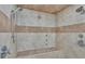 An updated shower stall with tile surround, built in seat, and dual shower heads at 59 Jimmy Lee Rd, Winter Haven, FL 33880